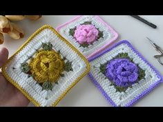 three crocheted squares with flowers on them