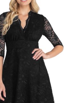 Ornate lace and semisheer sleeves create a gorgeous silhouette for this V-neck dress. 92% nylon, 8% spandex Dry clean Made in the USA Elegant V-neck Lace Dress For Night Out, Fitted V-neck Lace Dress For Party, Evening Lace Dress With 3/4 Sleeves, Sheer V-neck Lace Dress For Evening, Lace Dress With Sheer Sleeves For Night Out, Elegant Lace Dress With 3/4 Sleeves, Evening V-neck Lace Dress With Lace Bodice, V-neck Lace Top Dress For Party, V-neck Dress With Lace Top For Party