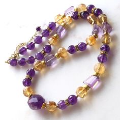 "7265 7266 Amethyst Citrine Necklace gold accents purple yellow natural gemstones bohemian statement modern choker birthday anniversary Christmas holiday gift for her women mom wife girlfriend daughter sister niece aunt grandmother cousin best friend colleague. Enjoy the beauty & power of natural stones.  This listing is for the NECKLACE only   EARRINGS shown for demo and listed separately at  https://www.etsy.com/ca/listing/1622911089/amethyst-citrine-earrings-gold-filled?click_key=d95b374f2fb3 Elegant Purple Crystal Necklace With Gemstone Accents, Purple Gemstone Necklace For Party, Gold Amethyst Crystal Necklace With Natural Stones, Elegant Gold Amethyst Crystal Necklaces, Purple Necklaces With Gemstone Accents, Amber Jewelry With Faceted Beads For Gift, Handmade Amethyst Gold Necklace, Bohemian Amber Jewelry With Gemstone Accents, Handmade Gold Amethyst Necklace