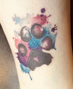 a close up of a person's leg with paint splattered on it