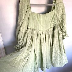 Beautiful Baby Doll Dress. Sage Green Color With White Pin Strip Design. Dress Is Fully Lined. Material Wrinkles Easy Last Picture Is To Show The Style And Fit (Not The Design/Color). Other Dress From Same Boutique. Too Large For Me (Typically Size Medium 6-8, Small Chested) And Can’t Return, But Never Worn. Cute Green Dress For Brunch, Cute Green Mini Dress For Brunch, Cute Green Cotton Mini Dress, Cute Green Square Neck Dress, Flowy Cotton Mini Dress With Square Neck, Cute Cotton Mini Dress With Square Neck, Green Flowy Dress With Puff Sleeves, Green Flowy Mini Dress With Square Neck, Cute Cotton A-line Mini Dress