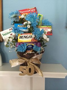 a vase filled with blue flowers sitting on top of a table