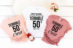 three t - shirts that say terrible 50 and terrible 50 are on top of each other