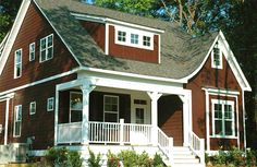 a red house with white trim and windows