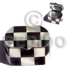 two pieces of black and white checkerboard design jewelry box with matching trays