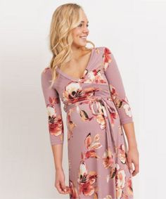 Our best-selling wrap dress is now available in the most perfect pink floral print for spring. Features high quality stretch fabric and 3/4 sleeves. Worn by pregnant, nursing, and postpartum mamas! As worn by "On Air with Ryan Seacrest" co-host, Sisanie, featured in People magazine. Color: Mauve Appearance of a wrap-dress, with out having to tie to close 95% Polyester, 5% Spandex Maternity, Postpartum & Nursing-Friendly Length measured from bustline to floor. S (0-4): Bust 33-36", Length 43" Spring Maternity V-neck Dress Nursing Friendly, Pink V-neck Maternity Dress For Maternity Wear, Spring Maternity Dress, Nursing-friendly, Spring Maternity Dress Nursing Friendly, Fitted V-neck Maternity Dress With Floral Print, Pink Nursing-friendly Maternity Dress For Spring, Pink Nursing Friendly Maternity Dress For Spring, Spring Nursing-friendly Pink Maternity Dress, Spring Pink Nursing-friendly Maternity Dress