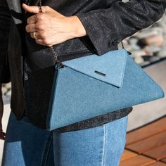 The Angelica is a chic denim evening bag crafted from trendy classy denim fabric and is accented with a diagonal flap. This stylish clutch bag features a fabric-lined interior, four credit card slots, a zipped pocket and a zip closure at the top. With a removable chain strap, The Angelica can be worn over the shoulder as a cross over purse or as a clutch. This will be your go-to day to night denim clutch handbag. OUTSIDE: Denim INTERIOR: Teal Lining HARDWARE: Gunmetal/Pewter WIDTH: 7.5″-12.5" HE Chic Denim Blue Shoulder Bag With Removable Pouch, Elegant Denim Shoulder Bag, Blue Denim Evening Bags, Elegant Denim Blue Bag For Everyday Use, Denim Clutch Bags, Nude Clutch, Denim Clutch, Casual Dresses For Teens, African Accessories