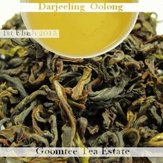 a cup filled with green tea next to a pile of dried leaves and the words darfeling oolong