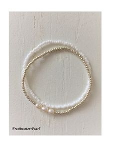 Genuine Freshwater Pearl White & Gold Seed bead bracelet This dainty delicate seed bead bracelet layer is made of Genuine Freshwater Pearl, surrounded by White/Gold glass seed beads. Made in the USA. Delicate Bracelet Gold, Baby Shower Jewelry, Pink Pearl Bracelet, Pearl Beaded Bracelet, Gifts Photography, Seed Bead Bracelet, Baby Bracelet, Seed Bead Bracelets, Layered Bracelets