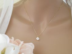 "This dainty pearl bridal necklace is perfect for the minimalist bride on her wedding day. Available in Gold or Silver. Necklace length: 16\" or 18\" + 2 inch extender chain. Pendant measures 0.5 inches. Items arrive in a beautiful hand decorated gift box. Ready to ship in 3-5 business days. To view the coordinating earrings: https://www.etsy.com/listing/1338107180/pearl-cluster-stud-earrings-bridal?click_key=f9e04e8c5b79cabe198f8c9544cf77f22bbae4a2%3A1338107180&click_sum=44357403&ref=shop_home_ Delicate Solitaire Necklace For Anniversary, Delicate Solitaire Necklace For Formal Occasions, Elegant Wedding Solitaire Necklace With Delicate Chain, Elegant Wedding Necklaces With Simple Design, Elegant White Necklaces For Bridal Shower, Wedding Solitaire Necklace With Round Pendant, Elegant Simple Wedding Necklaces, Delicate Pearl Pendant Bridal Necklace For Anniversary, Delicate Bridal Necklace With Pearl Pendant For Anniversary