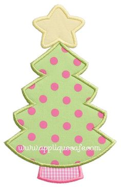 a green christmas tree with pink polka dots and a star on it's top