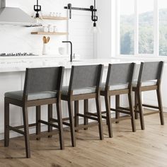 four chairs are lined up in front of the kitchen counter and island with open shelving