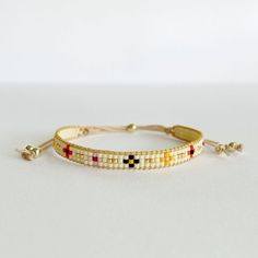 This bracelet is the perfect gift for every woman. Give a touch of color and simplicity to your daily outfit. ☆ ESPECIFICATIONS:  - Minimalist handmade bracelet made of 11-0 Japanese Miyuki glass beads and four 14K gold filled bead (never tarnish). - Miyuki beads are beaded in a special Miyuki thread and closed with a gold sliding bead. - Suitable for wrists of 6 inches (about 15 cm) and can be extend to 9 inches  (18cm).  ☆ TAKING CARE YOUR BRACELET: - Handle with care, seed beads are delicate. - Avoid squeezing tightly while wearing to prevent damage. - Keep away from water, perfumes and harsh chemicals. ☆ WARRANTY: We gives a six-month warranty on the jewelry from the date of purchase. If the defect is within the warranty, we will repair the product free of charge or find a replacement Bohemian Yellow Bracelets For Everyday Wear, Beaded Wrap Bracelet As Gift, Handwoven Beaded Bracelets With Round Beads, Everyday Yellow Beaded Friendship Bracelets, Handmade Yellow Cuff Bracelet, Yellow Bohemian Friendship Bracelets For Everyday, Adjustable Handwoven Braided Bracelets, Bohemian Yellow Friendship Bracelets, Handmade Minimalist Beige Jewelry