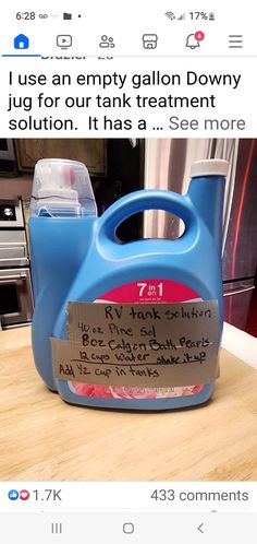 a blue jug sitting on top of a wooden table