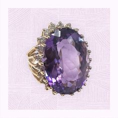 1980s Large Amethyst and Diamond Halo Ring in 14 karat yellow gold Elegant Yellow Gold Amethyst Ring With Accent Stones, Elegant Gold Amethyst Ring With Diamonds, Oval Gemstones With Diamond Accents Luxury Style, Elegant Lavender Amethyst Ring In 14k Gold, Elegant 14k Gold Amethyst Ring, Purple Oval Jewelry With Diamond Accents, Formal Lavender Amethyst Ring With Oval Shape, Formal Lavender Oval Amethyst Ring, Elegant Amethyst Ring With Gemstone Accents For Anniversary