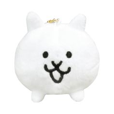 a white stuffed animal with black eyes