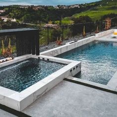 an outdoor hot tub in the middle of a patio