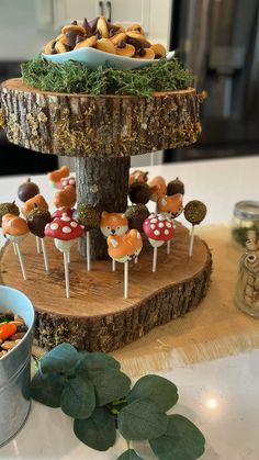 there are many desserts on the table with mushrooms and carrots in them, including marshmallows