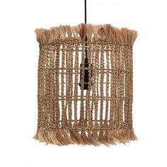 a hanging light made out of straw and rope