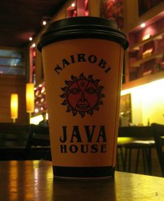 a coffee cup sitting on top of a wooden table