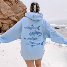 🦈 Sharks on the back of a full zip up Hoodie Sweatshirt jacket for Men and Women. Available in Plus Sizes (see photo lineup for size chart). A lounge essential for the beach, travel, or home. 🌊 🧶 FEATURES: * 8.4 oz./yd², 80/20 ring-spun cotton/polyester * 100% ring-spun cotton face * Classic fit; SIZE UP for that OVERSIZED VIBE 😎 * 2-piece color matched jersey fabric lined hood * Dyed-to-match zipper * Dropped shoulder * Pouch pocket * 1x1 rib with spandex cuffs and bottom band for enhanced Crew Neck Outerwear With Kangaroo Pocket, Relaxed Fit Long Sleeve Hoodie For Outdoor Activities, Relaxed Fit Long Sleeve Hoodie For Outdoor, Long Sleeve Relaxed Fit Hoodie For Outdoor Activities, Casual Long Sleeve Sweatshirt With Shark Design, Shark Jacket, Shark Clothes, Sweater Graphic, Full Zip Up Hoodie