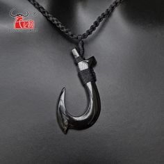 Stay Stylish with the Black Fish Hook Necklace Elevate your style with the trendy Black Fish Hook Necklace. Whether you're rocking a western outfit or a casual t-shirt, this necklace is the perfect accessory to enhance your look. Handcrafted with a stunning black finish, the fish hook pendant exudes elegance and beauty. Made from high-quality buffalo horn, this necklace is not only stylish but also safe for your skin. Designed to suit all ages, the Black Fish Hook Necklace is a versatile piece t Casual Black Pendant Jewelry, Black Casual Jewelry With Adjustable Chain, Casual Black Jewelry With Adjustable Chain, Surfer Jewelry, Black Fish, Fish Hook Necklace, Hook Necklace, Men's Necklace, Fashion Jewelry Necklaces