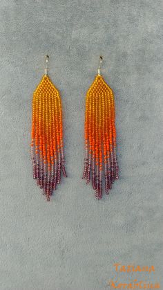 These unique handmade earrings are made of high-quality Czech beads and strong synthetic thread. They are elegant, fashionable, and highly versatile, suitable for everyday wear. Color: orange, purple . There may be some color discrepancies which is due to the different monitor settings I will make these earrings for you in your favorite size. 100% hand made with love! Measurements: Length-about 10,5cm (4.13 inch) Width -about 2 cm (0.79 inch) Materials: Sterling silver components Czech glass bea Orange Dangle Earrings With Tiny Beads, Orange Beaded Fringe Jewelry For Gifts, Handmade Orange Tassel Earrings For Summer, Orange Handwoven Dangle Beaded Earrings, Beaded Orange Tassel Earrings As Gift, Orange Beaded Tassel Earrings For Gift, Gift Orange Beaded Tassel Earrings, Adjustable Orange Tiny Beads Earrings, Orange Beaded Fringe Earrings With Round Beads