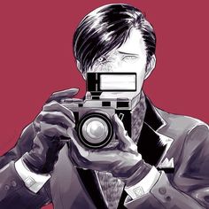 a man in a suit taking a photo with an old fashioned camera on red background