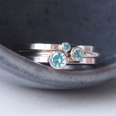 ** Order before 17th December for Christmas Delivery (UK ONLY ) ** MARCH Birthstone Ring in a stackable design. Wear one, wear a few with different sized gems, or mix with other colours of birthstones. - Silver and Aquamarine Blue Gemstone Ring - March Birthstone - Choice of gem size 2mm, 3mm or 4mm - Choice of Band style - Modern Square or fully Round options - 1.5mm wide band, made to your choice of ring size - Sterling Silver - Cubic Zirconia - Handmade in Scotland UK - Gift Boxed in a reusab Stackable Round Topaz Ring As Gift, Unique Blue Stackable Jewelry, Adjustable Stackable Rings With Stone Setting, Stackable Round Topaz Ring For Anniversary, Anniversary Stackable Topaz Ring, Stackable Sapphire Ring, March Birthstone Rings, Aquamarine Birthstone Ring, Customised Jewellery