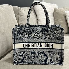 Christina Dior Medium Dior Book Tote Ecru And Blue Toile De Jouy Embroidery (36 X 27.5 X 16.5 Cm) Dior Aesthetic, Christian Dior Paris, Book Tote Bag, Dior Book Tote, Embroidered Monogram, Chanel Deauville Tote Bag, Brunei, Satchel Bags, Dior Bag