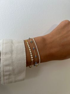 "Dainty beaded pavé bracelet is super chic & minimalist! Looks great paired with other bracelets or by itself!  Matching Necklace available! https://www.etsy.com/listing/1222967305/dainty-beaded-necklace-dainty-necklace?click_key=275df650b1d8bc35479987c32a32d3a1c42533c2%3A1222967305&click_sum=62015218&ref=shop_home_active_16&pro=1&sts=1 - - - D E T A I L S - - -  * Made of 925 Sterling Silver * We use a THICK, DURABLE plating of 14k Gold or Rhodium - for a piece that will be with you for years to come!  * Available in sizes 5.5\", 6.25\", and 6.75\" + .5\" Extension Chain * Lobster Clasp Closure * Nickel-free & Hypoallergenic  * Made of highest grade cz's for an authentic sapphire look! * Also available in Ruby, Emerald, or Diamond  RUBY https://www.etsy.com/listing/1209067278/beaded-brace Luxury Minimalist Bracelet With Round Beads, Luxury Yellow Gold Minimalist Beaded Bracelets, Luxury Adjustable Minimalist Beaded Bracelets, Affordable Adjustable Minimalist Gold Bracelet, Luxury Gold Dainty Beaded Bracelets, Cheap Dainty Bracelet Jewelry, Luxury Gold Minimalist Beaded Bracelets, Dainty Stackable Jewelry At Affordable Price, Affordable Dainty Gold-plated Jewelry