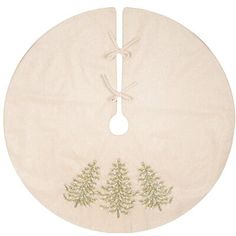 a round table mat with trees embroidered on the front and bottom, hanging from a string