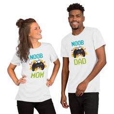 PLEASE READ. The price is for a single shirt. You can match with your son on his birthday party but you don't know nothing about video games so the Noob Mom or Noob Dad is the perfect shirt for you!! There is another options availables to choose just let me know in a convo so I can work with you to complete your family matching set. -Gamer Sister -Gamer brother -Gamer Dad -Gamer Mom This Funny Gamer Birthday party shirt is the perfect gift present for that Pro-Gamer boy who love play Video Games Fun T-shirt For Father's Day Birthday, Funny T-shirt For Birthday And Father's Day, White Novelty T-shirt For Birthday, Funny Print Tops For Birthday And Father's Day, Funny Shirt For Birthday And Father's Day, Funny White T-shirt For Father's Day, White T-shirt For Father's Day Family Events, White Shirt With Funny Print For Father's Day, Fun Birthday Shirt With Funny Text