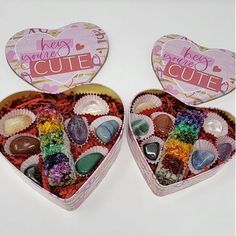 two heart shaped tins filled with candy