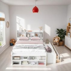 a bedroom with a bed, bookcases and stuffed animals on the shelves in it