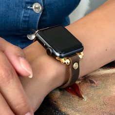 High Quality Slim Brown Color Leather Strap with Gold Accents. Women Style Classy Strap with Adjustable Buckle. Gorgeous Design Bracelet Tailored to Perfection. Designed And Handmade by Simeon D Jewelry Studio. This Bracelet Fits ALL Apple Watch Series. Please Measure Your Wrist Before Submitting Your Order! Not For Other Models. Apple Watch Is NOT Included. Let's be Friends! Follow my Studio on Social Media Instagram @simeondjewelry Pinterest @simeondjewelry Facebook @simeondjewelrystudio Adjustable Round Gold Watch Bands, Adjustable Gold Round Watch Bands, Adjustable Gold Apple Watch Band, Adjustable Leather Strap Watch Accessories, Gold Leather Strap Apple Watch Band For Everyday, Everyday Gold Leather Strap Apple Watch Band, Gold Leather Strap Watch Band For Everyday, Everyday Gold Apple Watch Band With Leather Strap, Gold Watch Band With Leather Strap For Everyday