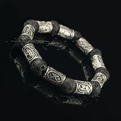 Viking Bracelet - Viking Jewelry - Scandinavian Bracelet - Bracelet with Runes - Elder futhark runes - Lava bead bracelet - Futhark runes  Beautiful gift idea for women, men, Christmas, Valentine's Day, Birthday, Father's Day or any other occasion.  Great accessory for all viking fans.  Each bracelet has 9 runes (may differ depending on the size chosen) with powerful meanings according Norse and Celtic mythologies and lava stones. Lava stones are great aroma oil diffusers.   Different runes and Symbolic Silver Bracelets With 8mm Beads, Symbolic Black Engraved Bracelets, Black Symbolic Engraved Bracelets, Silver Symbolic Bracelets, Hand-strung, Runes Elder Futhark, Viking Leather Bracelet, Viking Style Silver Metal Bracelet, Adjustable Black Viking Bracelet, Adjustable Leather Viking Bracelet