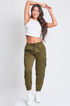 Keep it cute and casual in our Women’s Joggers with Nylon Pockets. These trendy mixed-media joggers are constructed with a soft, midweight polyester fabric and feature pleated flap cargo pockets made of parachute-style material. These lounge pants feature an elastic waist with drawstring closure, inseam front pockets, and an elastic hem. Style with a fitted tank and sneakers for an on-trend sporty vibe. Product Details- High-Rise- Elastic Waist with Drawstring Closure- Inseam Front Pockets- Doub Casual Nylon Joggers With Drawstring, Green Nylon Cargo Pants For Athleisure, Green Nylon Cargo Pants In Athleisure Style, Casual Nylon Joggers With Pockets, Spring Sporty Cargo Pants With Cargo Pockets, Sporty Spring Cargo Pants With Cargo Pockets, Sporty Spring Parachute Pants With Multiple Pockets, Casual Nylon Sweatpants With Side Pockets, Sporty Khaki Cargo Pants With Cargo Pockets