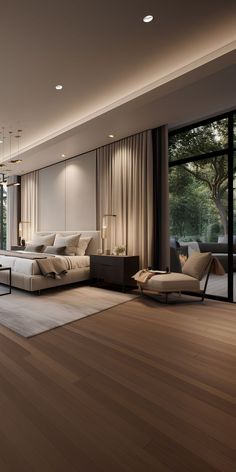 a modern living room with wood floors and large windows that look out onto the trees