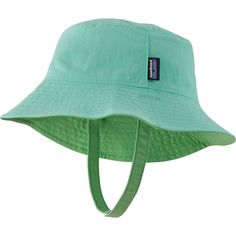 We plop the Patagonia Baby Sun Bucket Hat on our little one's head to get them ready for sun-filled adventures. This reversible hat has a full-wrap brim for total sun protection and a chin strap with hook-and-loop closure to keep it on our little one's head. Wide Brim Bucket Hat With Upf 50+ For Playtime, Green Sun Hat With Upf 50+ And Adjustable Fit, Green Outdoor Hat, Green Adjustable Sun Hat With Uv Protection, Green Sun Hat With Uv Protection And Adjustable Fit, Adjustable Fit Green Hat For Beach, Patagonia Adjustable Curved Brim Hat, Green Adjustable Fit Bucket Sun Hat, Adjustable Fit Green Brimmed Sun Hat