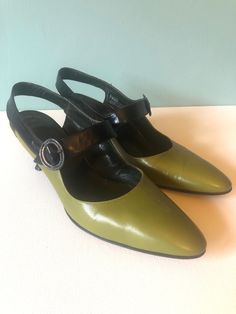 "AMALFI Vintage Black And Green Slingback Designer Shoes, 1960's  Made In Florence Italy, Rangoni. Size 6 1/2 AA Approx 2 1/2\" heel Condition- Shoes have been gently used. The colors are amazing.  ~ If purchasing more than one item CONVO me regarding shipping costs ~" Retro Ankle Strap Heels For Formal Occasions, Retro Green Heels For Evening, Vintage Green Heels For Formal Occasion, Vintage High Heel Slingback Pumps For Evening, Retro Leather Slingback Heels, Vintage Ankle Strap Slingback Pumps For Evening, Vintage Slingback Pumps With Ankle Strap For Evening, Vintage Slingback Pumps For Spring Formal, Vintage Green Heels