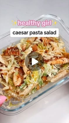 a glass dish filled with chicken and coleslaw next to a hand holding a plastic container