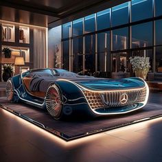 a futuristic car is on display in front of large windows