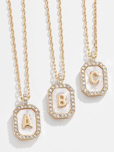 You can't go wrong with a classic initial pendant. Our Gold & Mother of Pearl Initial Necklace features a dog tag-style pendant on a dainty gold chain with the letter of your choice in the center. Better yet? We added a mother of pearl background on the pendant to make your personalization pop. Pearl Background, Dainty Gold Chain, Jewelry Accessories Ideas, Initial Necklace Gold, Initial Pendant Necklace, Senior Pics, Initial Pendant, Dog Tag, Gold Pendant Necklace