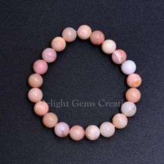 Product Details : Item Code : DGC1100Gemstone Name :  Pink OpalChain Style : BeadedBeads Shape : Smooth Round Beads Size : 10 MM  ApproxLength : 8"Inch/  StretchableWeight : 115 Cts. ApproxCustomization : **Available**Please Feel Free To Contact If You Have Any Query. Pink Natural Stones Round Stretch Bracelet, Pink Natural Stone Stretch Bracelet, Pink Opal Round Beads Jewelry, Pink Natural Stones Stretch Bracelet, Pink Opal Bracelets As Gifts, Pink Natural Stones Round Beads Bracelets, Pink Polished Beads Bracelet, Pink Round Beads Bracelets With Natural Stones, Pink Polished Beaded Bracelets