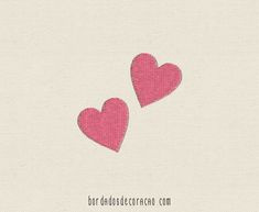 two pink hearts on a white background with the words love is in the air above them