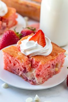 a piece of strawberry cake with whipped cream on top