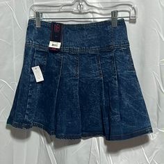 The No Boundaries Denim Pleated Skirt Is Fun, Flirty And Playful, All While Being Seriously Soft And Comfy. With A High-Rise Waist And No-Gap Waistband, This Mini Skirt Will Accentuate And Flatter The Waistline. But The Real Mvp In This Style In Your Leg! With A Mini Skirt Length Complete With Pleats, This Piece Is Designed To Show Off. Stretchy, Comfortable, Easy To Wear, And Cute. Pair With Sneakers For A Casual And Cool Look. Material: 100% Polyester Care: Machine Washable Country Of Origin: Denim Pleated Skirt, Pleaded Skirt, Double Belt, Skirt For Women, Pleated Mini Skirt, No Boundaries, Skirt Length, Boundaries, Pleated Skirt