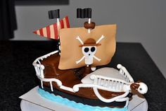 a cake with a pirate ship on it