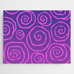 a purple and pink pattern with spirals on it